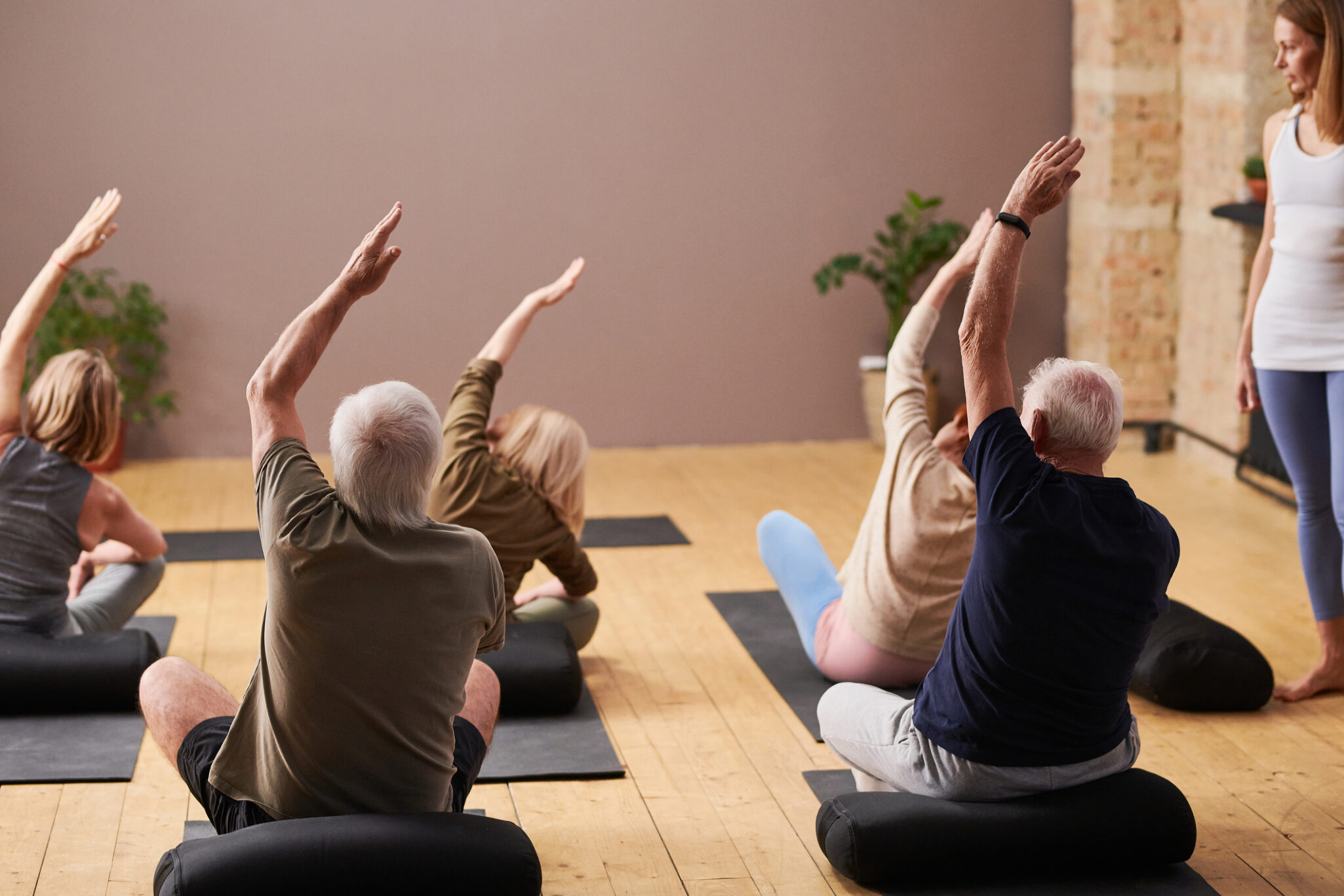 Elderly people doing yoga